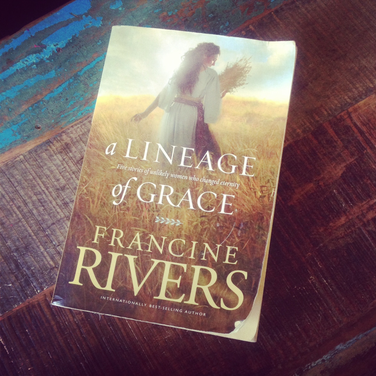 francine rivers a lineage of grace book sitting on a wooden table